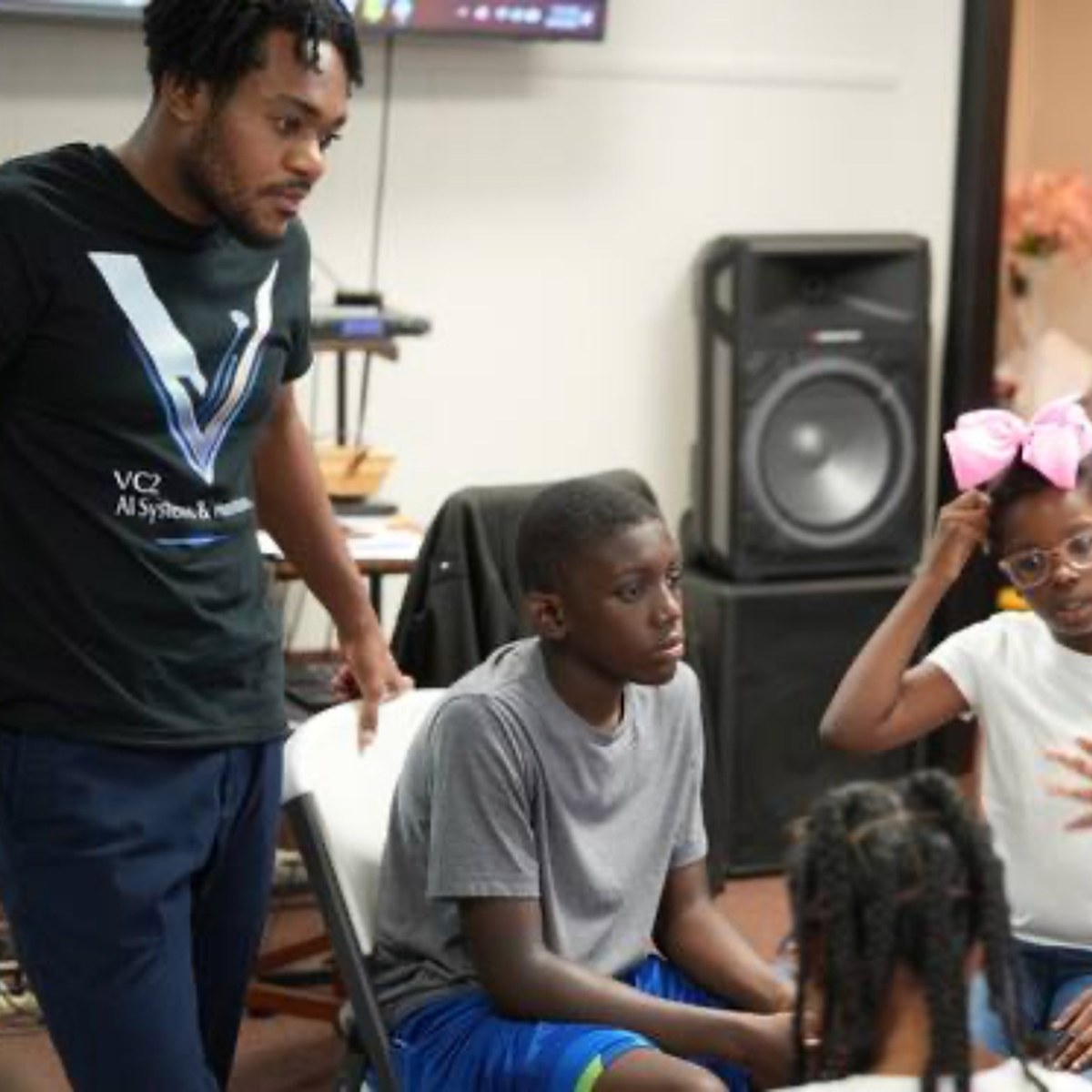 Vanwayne Chaney Jr. running a hands-on AI session with middle and high school students
